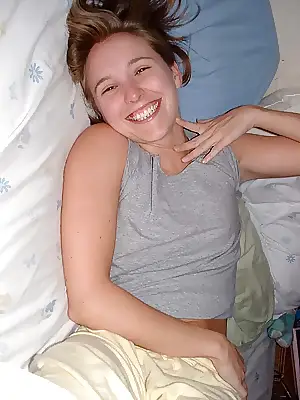 adorable cutie in bed spreading her cheeks showing off her body